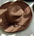 Foldable wide brim brown straw sun hat for women featuring a stylish bow detail for beach vacations - Hand-woven with Bow Tie / Coffee