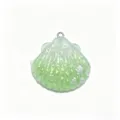Green resin shell DIY charm with glitter detail, perfect for keychains, hair clips and bags. - Green