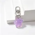 Close-up detail of the purple jelly star keychain, highlighting translucent resin pendant texture. - Purple