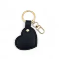 Black heart leather keychain detail shot, minimalist DIY bag pendant and key ring accessory. - Black