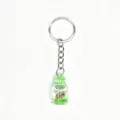 Creative glowing drift bottle keychain with mini conch and green liquid, stylish bag charm. - Mint Green