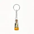 Ocean theme wishing bottle keychain with mini conch and shell, cute beach bag charm accessory. - Orange