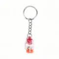 Creative luminous drift bottle keychain with orange sand and tiny shell pendant accessory. - Red