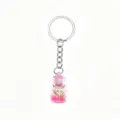 Ocean style drifting bottle keychain with miniature conch and pink sand for cute DIY bag charms. - Pink