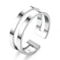 Detail view of a minimalist silver double band open ring, modern geometric metallic jewelry. - Steel 5