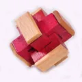 Wooden interlocking puzzle brain teaser toy close up detail, natural and red wood blocks. - Gold Interlocking Double Heart