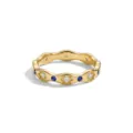 Detail close-up shot of gold wavy ring featuring white floral crystals and blue stones. - Size 6 / Blue Rhinestone