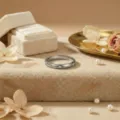 Close-up detail of silver paved diamond ring with elegant box and pearl decor. - Size 5 / Silver-White Zircon