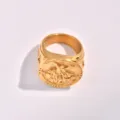 Detailed close-up of men stainless steel signet ring with Saint Michael engraving in gold finish. - Size 7 / Gold