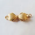 Detailed macro shot of the gold-plated bow jewelry clasp connector for DIY crafts and necklaces. - 1-Ring / Gold