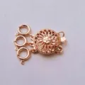 Close-up of rose gold multi-strand clasp, hollow sunflower design, shiny copper jewelry finding. - Rose Gold