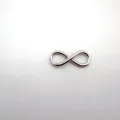 Stainless steel infinity charm pendant, polished metal DIY jewelry connector detail. - Infinity