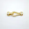 Gold-plated horseshoe jewelry clasp detail, sparkling pavé cubic zirconia decoration. - Horseshoe Gold