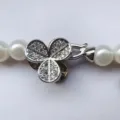 Detailed shot of a clover crystal rhinestone pearl necklace clasp jewelry accessory replacement. - Clover Single Clasp / Silver