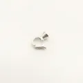 Close-up detail of silver-colored DIY jewelry clasp connector for pearl necklaces and bracelets. - S / White