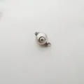 Close-up detail of silver stainless steel ball clasp for DIY jewelry making and necklaces. - 9mm / White
