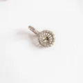 Close-up detail of DIY metal micro-paved pendant bail clasp for pearl necklace making. - White