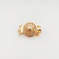 Close-up detail of the gold-plated copper sunflower jewelry clasp, perfect for DIY bracelets. - A227 Triple Ring Gold