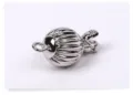 Detail view of a classic 8mm ribbed lantern ball clasp for DIY pearl necklace making. - Lantern Buckle / White Gold