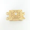 Close-up of a gold-plated multi-row jewelry clasp with vintage filigree and central stone. - 2 Rows / Gold