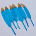 Gradient blue craft feathers with gold tips, perfect for DIY jewelry and handmade decor. - Lake Blue with Gold Tips
