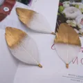 DIY white gold dipped feather craft accessories with metal loops for jewelry making design. - White Gold-Sprayed Tip