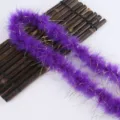 Detailed view of the purple feather boa with gold tinsel, perfect for craft and gifts. - Deep purple
