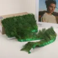 Green spotted feather trim ribbon with fabric tape for DIY sewing crafts and clothing accessories. - Fruit Green