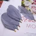Grey feather DIY jewelry accessories with metal clips, perfect for handmade clothing crafts. - Gray