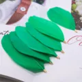 Vibrant green DIY feather jewelry charms with metal loop connectors for handmade craft designs. - Grass Green