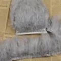 Grey feather trim fringe ribbon turkey feathers for DIY clothing crafts and home decor. - Gray