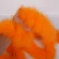 Bright orange feather boa variant, fluffy costume accessory for party or apparel decor. - Orange