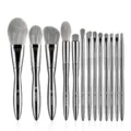 13-piece professional makeup brush set with elegant silver handles and soft grey synthetic bristles. - Thirteen Pieces Nude Brushes