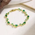 Close-up detail of the elegant green zircon leaf vine gold-plated bracelet texture. - 7880 Green Zirconia Flower (Gold)