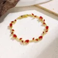 Gold-plated red zircon leaf bracelet detail view showing delicate vine design for women. - 70067 Red Zirconia Flower (Gold)