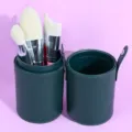 7-piece makeup brush set with dark green cylindrical PU leather holder, soft synthetic bristles. - 7 Rainbow Brushes with Green Tube