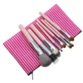 Detailed view of 8-piece pink striped makeup brush set with portable cosmetic bag. - Pink 8-Piece Set / Pink