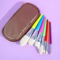 7-piece colorful makeup brush set with bronze cosmetic bag for professional daily beauty use. - 7 Rainbow Brushes with Brown Zipper Bag
