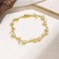Elegant gold-plated vine leaf cubic zirconia bracelet, chic fashion wrist jewelry for women. - 7874 White Zirconia Flower (Gold)