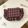 Close-up detail of the vintage plaid cosmetic bag with elegant ruffled trim on white table. - 22*17CM / Red Gray Plaid
