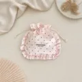 Detailed view of pink satin polka dot drawstring pouch with ruffles for jewelry and cosmetics. - 15.5*17cm / Pink