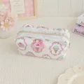 Close-up of a cute pink floral makeup bag with white lace trim and bow detail on textured desk. - L / Cake Ice Cream Print