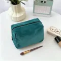 Dark green corduroy makeup bag detail, textured cosmetic storage pouch with zipper closure. - 18x9x13cm / Dark Green