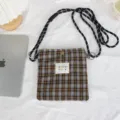Plaid mini crossbody bag detail showcasing fabric texture, adjustable strap and cloth label. - 17*20cm / Yellow Brown Plaid