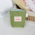 Detailed shot of green grid nylon coin purse, mini zipper pouch with cute label for daily use. - S / Green