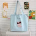 Bolsos tote de lona azul claro con bordado de cerdito tierno y cordón para la escuela. - Azul claro