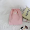 Roze trekkoord opbergtas detail, reis stofdichte zak, zachte draagbare make-up tas voor reizen. - Perzikroze