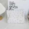 Corduroy floral cosmetic bag detail view, sweet bow pattern pouch, portable makeup storage. - Light Pink Grey Bow Cosmetic Bag