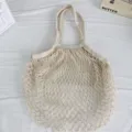 Beige gewebte Netz-Hohleinkaufstasche, tragbare Netztasche für Lebensmittel und Strandurlaub. - Beige