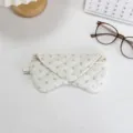 Quilted floral glasses case detail, soft padded storage pouch for sunglasses and eyewear. - White Base Floral